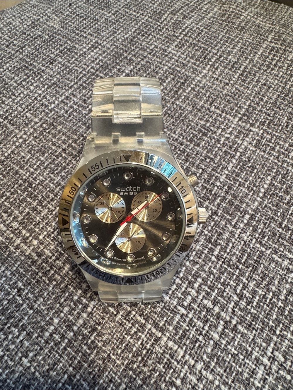 Swatch Black Dial Silver Accents Clear Strap Chronograph